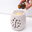 Natural Rosy beige handcrafted oil burner for diffusing aromatic scents.
